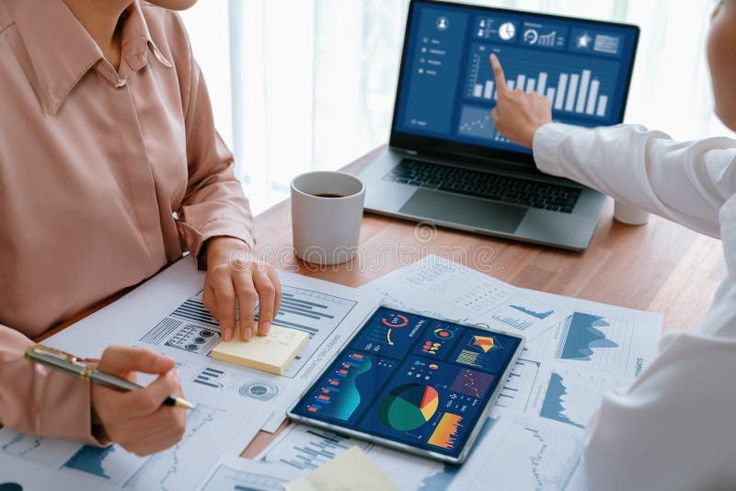 analyst team colleague discuss financial data on digital dashboard enthusiastic royalty